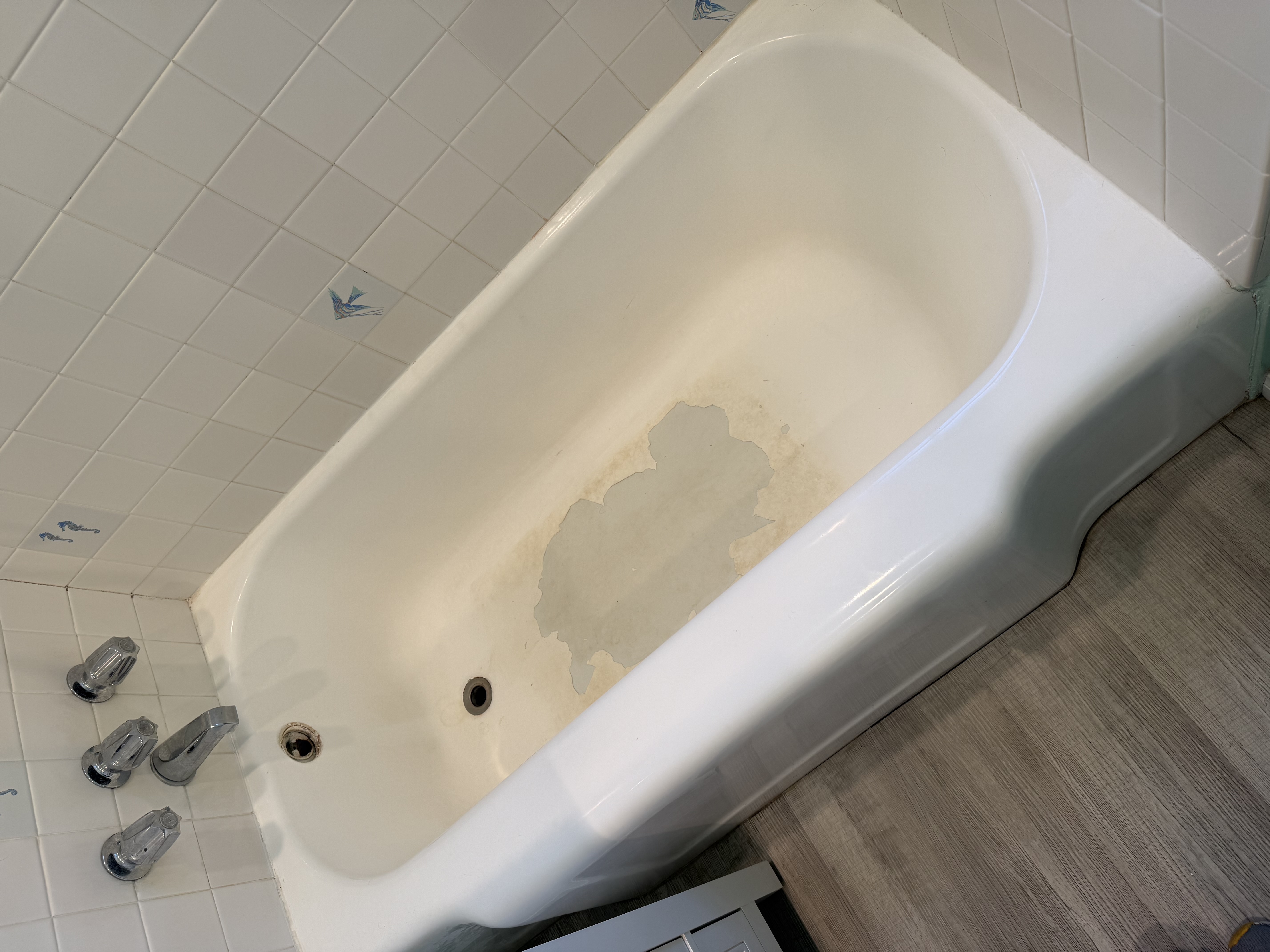 Peeling bathtub coating before repair