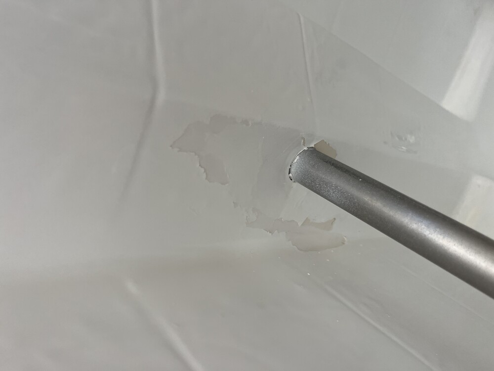 Peeling DIY spray coating on plastic bathtub in Van Nuys