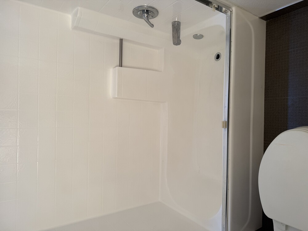 Stripping old coating and applying plastic bonding agent