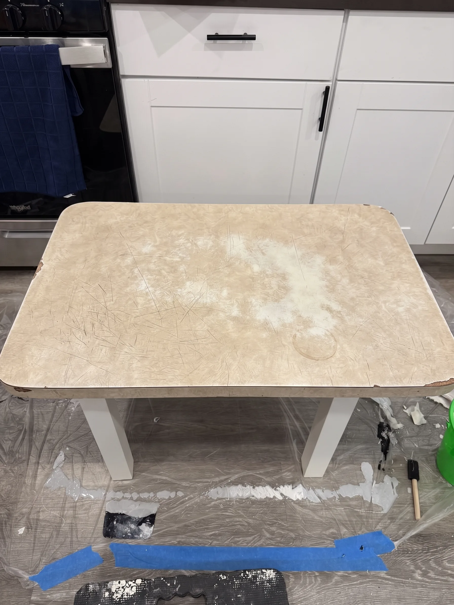 Dated, worn laminate kitchen countertop with stains and dull finish before refinishing in Los Angeles